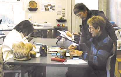 Irene helps an artist